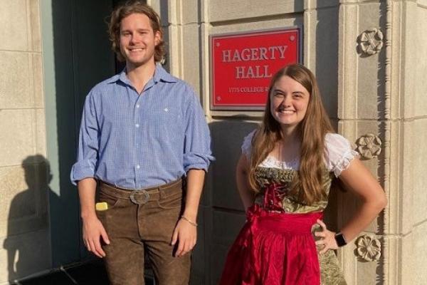 Gustav Grimm and Haley Grubb in Tracht September 2022 in front of Hagerty Hall