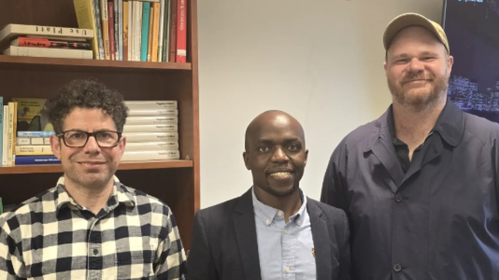 Rop standing with his advisors